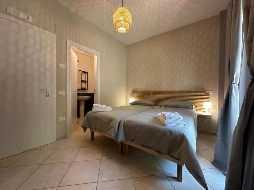 a bedroom with a large bed in a room at Cinelli Apartment Stio Cilento in Magliano Nuovo