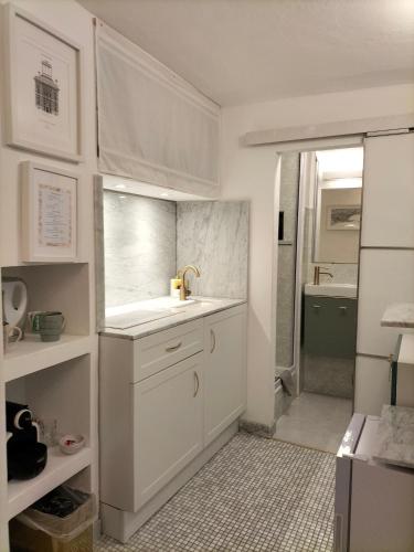 a small bathroom with a sink and a shower at Il Piccolo Giustiniani 20 in Genova