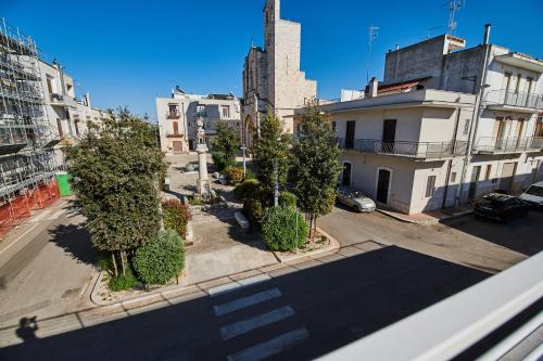a view of a street with trees and buildings at Domus Villanova in Triggianello