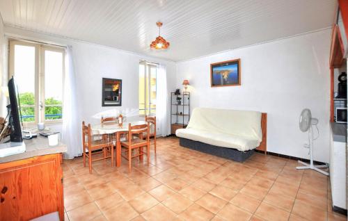 a living room with a bed and a table at Gorgeous Apartment In Port-Vendres in Port-Vendres