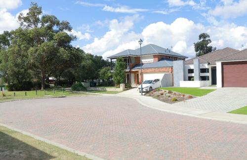 a brick driveway in front of a house at Home Sweet Perth in Perth