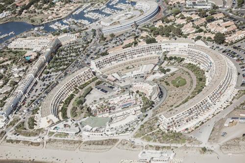an aerial view of a city with buildings at Héliopolis F9 in Cap d'Agde