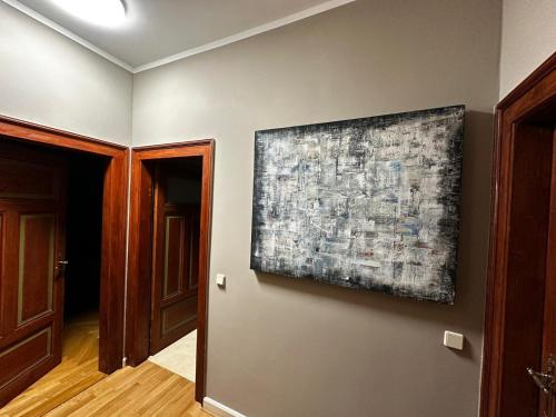 a painting hanging on a wall in a room at Villa Illuminati in Gotha