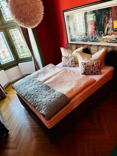 a bedroom with a bed with pillows on it at Villa Illuminati in Gotha