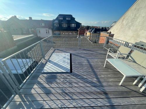 a deck with two chairs on a balcony at Villa Illuminati in Gotha