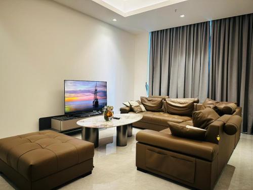 a living room with a couch and a table at The address, Colombo in Colombo