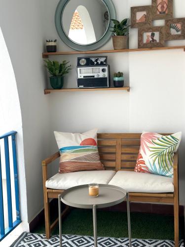 a couch and a table in a room at Apartment in Altura, Algarve with Balcony Near Beach and Town Center in Altura