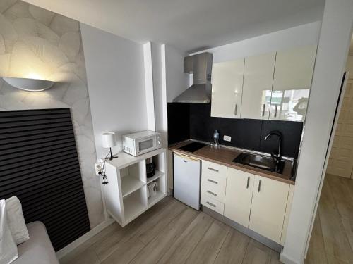 A kitchen or kitchenette at Cozy Studio in Los Cristianos Beach FREE WIFI