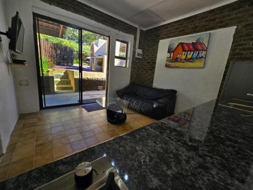 a view of a living room with a couch at Pine Valley in Lanseria