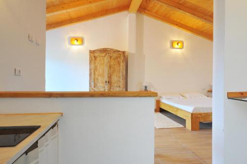 Ένα ή περισσότερα κρεβάτια σε δωμάτιο στο Agriturismo Cultisia Luogosanto