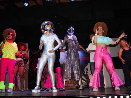 a group of women on the stage performing on a stage at Hotel Margarita Village in Porlamar