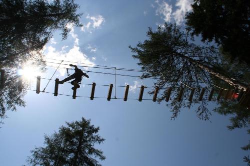 a person is jumping on a ski lift at Berggasthof Hochzeigerhaus in Jerzens