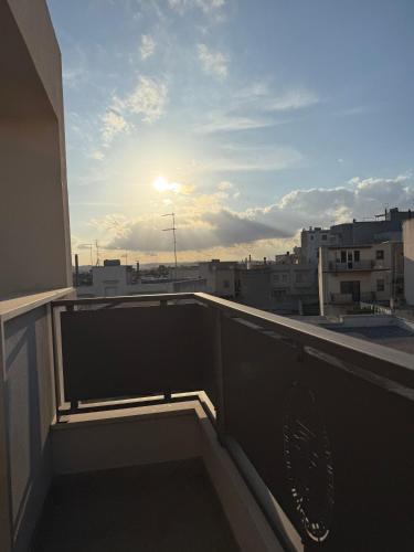 a balcony with a view of a city at La Dimora Degli Dei in Carovigno