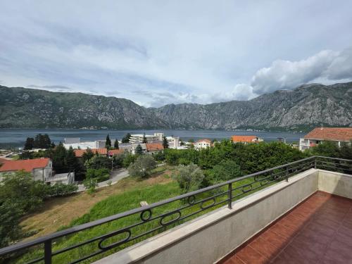 a view of the water from the balcony of a house at Apartments Soso in Kotor