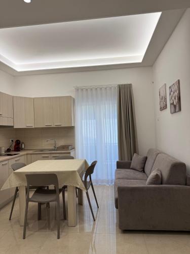 a living room with a couch and a table at La Dimora Degli Dei in Carovigno