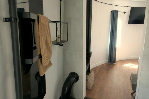 a hallway with a towel hanging on a wall at Watertoren Hengelo in Hengelo