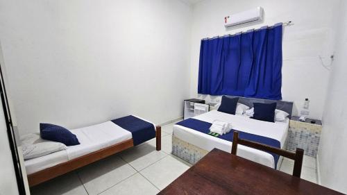 Ένα ή περισσότερα κρεβάτια σε δωμάτιο στο Hotel Litoral Norte
