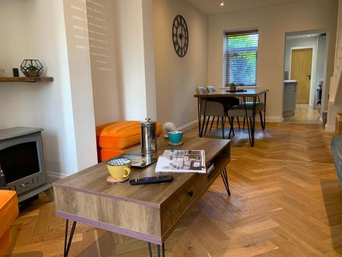 a living room with a coffee table and a couch at Minster Cottage - Cathedral Quarter with Free Parking in Lincoln