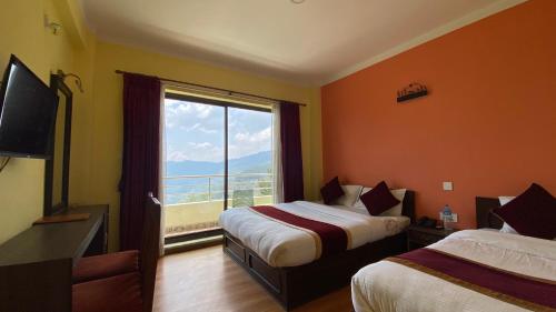Postel nebo postele na pokoji v ubytování Hotel Nagarkot Inn