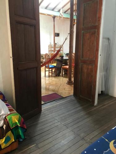 an open door leading to a room with a table at Hostal Casa Ramirez in Jericó