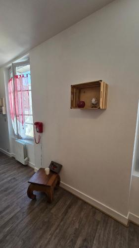 an empty room with a table and a window at Le Petit Fleur de Loire in Blois