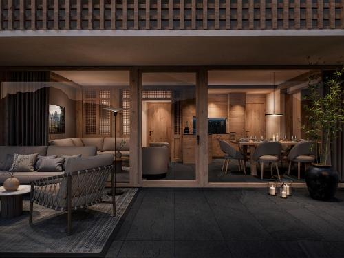 a living room with a couch and a table at Sandhof Apartments in Lech am Arlberg