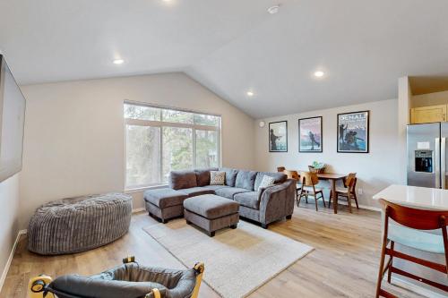 a living room with a couch and a table at Girdwood Vibes, Unit B in Girdwood