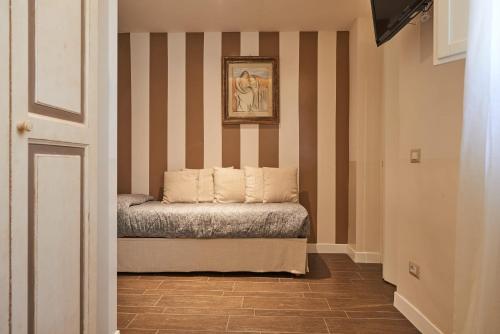 a room with a bed with two pillows on it at B&B Le Stanze del Duomo in Florence