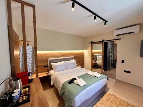 Giường trong phòng chung tại Agora Luxury Apartments Ioannina
