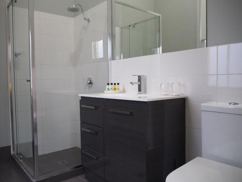 a bathroom with a sink and a shower at City Quarters on Brewer in Perth