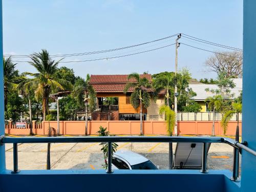 a car is parked in front of a house at Sunshine Place Udon in Udon