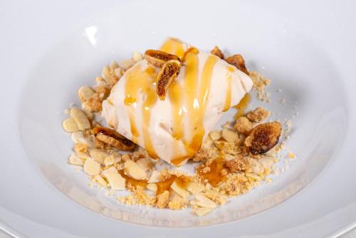 a plate of food with ice cream and nuts at Hotel Villa Rita in Paestum