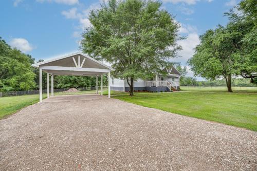 a driveway with a pavilion in front of a house at Less Than 1 Mi to Lake Fork Appy Haven in Yantis in Yantis