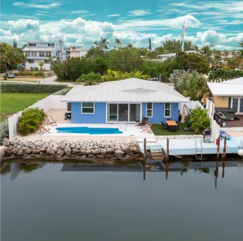an aerial view of a house on the water at 4BR Sombrero Beach House on Canal w Dock & Pool in Marathon