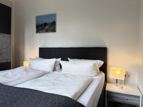 Giường trong phòng chung tại Wohnung im historischen Bahnhof, Drei Annen Hohne