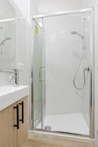 a bathroom with a shower with a glass door at Danito Rooms 2 matrimoniale in Ancona