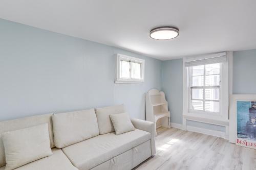 a living room with a white couch and a window at Walk to Ocean Grove Beach Apt in New Jersey in Ocean Grove