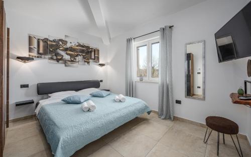 En eller flere senge i et værelse på Villa Paradise