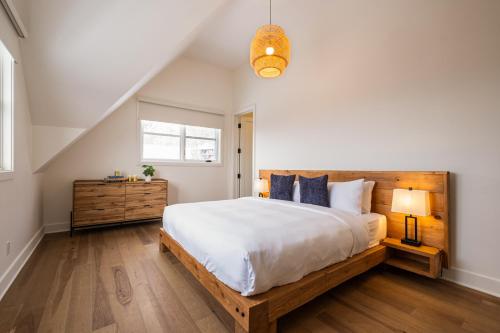a bedroom with a large bed and a window at NEW! Villa Panorama 4 Seasons Heated Pool Hot Tub in Mont-Tremblant