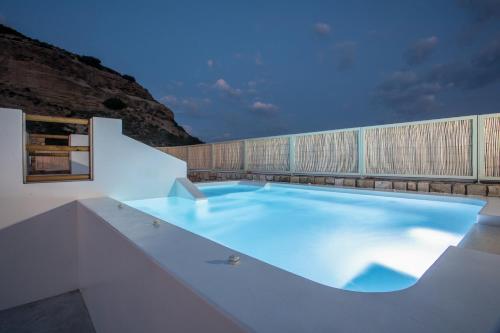 a large swimming pool in a building at Villa Elaia in Afantou