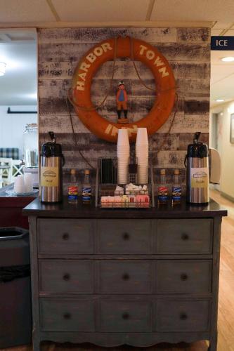 a dresser with a sign on top of it at Harbor Town Inn, BW Signature Collection in Manitowoc
