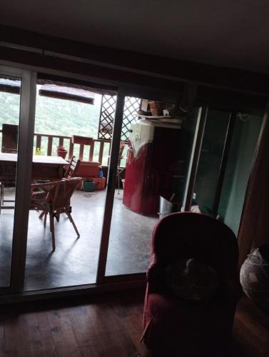 a room with a view of a living room with a table at Entre Terre et Ciel. in Saignon