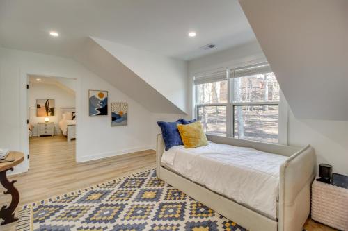a bedroom with a bed and a large window at 3 Mi to Winery Jasper Mountain Chalet with Hot Tub! in Jasper