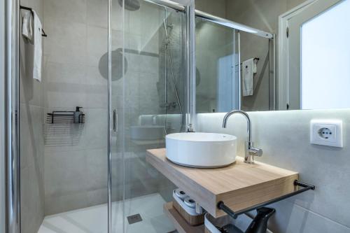 a bathroom with a sink and a shower at ApartmentsPorto - Porto Dukes House in Porto