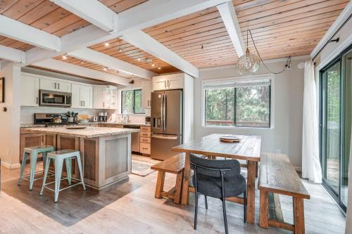 a kitchen with a table and chairs and a dining room at Family Cabin in Blue Lake Springs, Near Town! in Arnold
