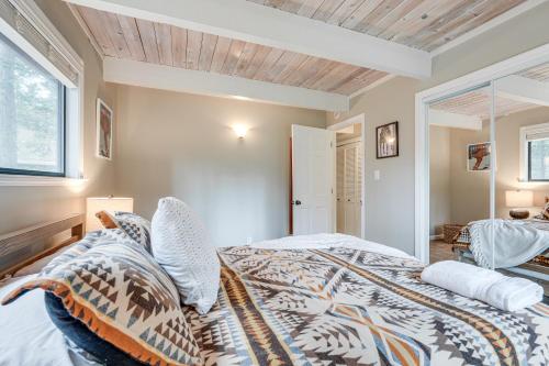 a bedroom with a king sized bed and a window at Family Cabin in Blue Lake Springs, Near Town! in Arnold