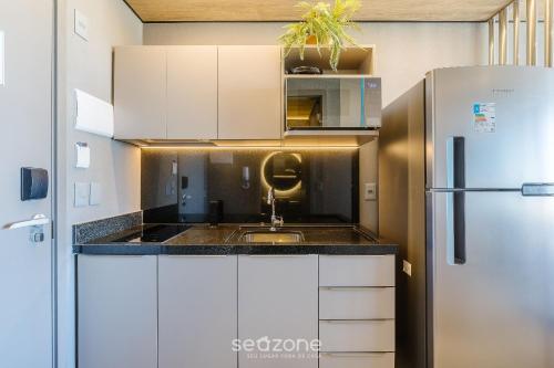 Una cocina o cocineta en NWTs - Estudios con vista lateral al mar en Maceió III