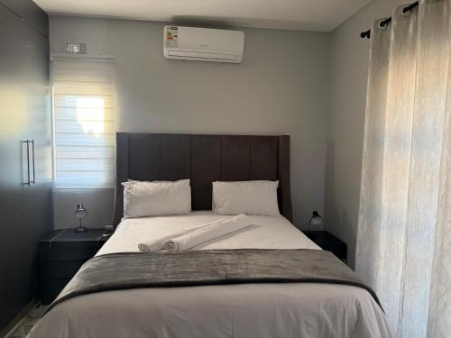 Кровать или кровати в номере Mountain Drive Apartments