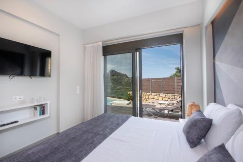 Postel nebo postele na pokoji v ubytování Porti Villas Iraklis