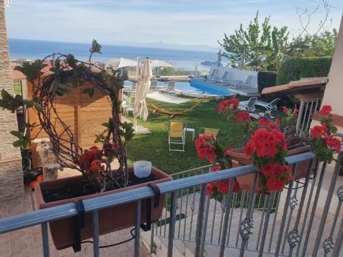 a balcony with a view of a swimming pool at Appartamenti Borgo Panoramico N 5 in Tropea